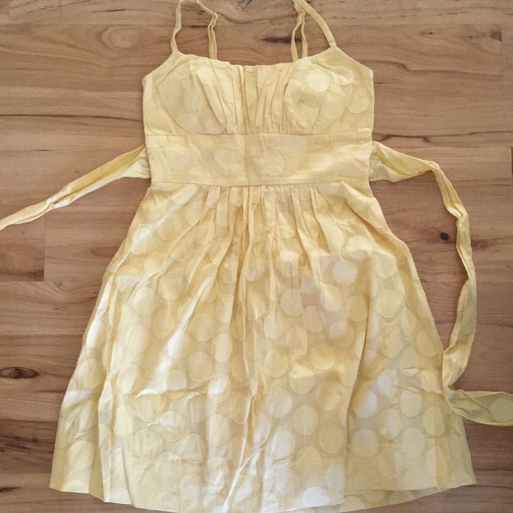 Pale yellow sundress with polka dot detailing